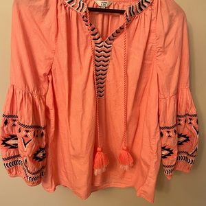 Crown and ivy peasant top with Aztec detail. Coral color